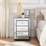 Crushed diamond mirrored nightstand with three drawers in a modern bedroom setting