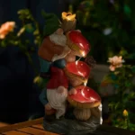 Goldoma resin gnome statue with water stream detail, positioned near a garden path in daylight.