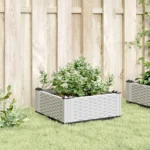 Large 12-inch white planter from the W2B VidaXL set, shown with soil and a small green plant.