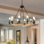 32-inch rustic farmhouse 10-light candle chandelier in black metal and wood, hanging over a dining table in a cozy room