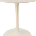 White rounded marble pedestal base dining table with iron base in a modern dining room