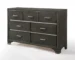 Gray modern bedroom dresser with mirror in a bright bedroom setting