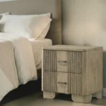 Antique oak nightstand with two drawers, grooved front panel, and rounded edges