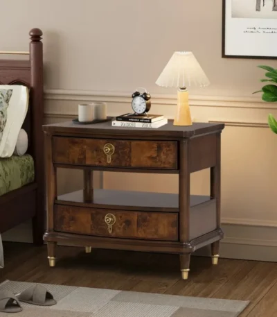 Modern nightstand with power outlet, dark cherry finish, gold legs, two drawers, and key knobs - Goldoma