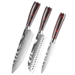Japanese kitchen knife set with three knives on wooden cutting board