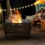 Modern outdoor fire pit with flames and seating area