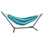 Two person hammock with stand in blue and green stripes on a sunny patio