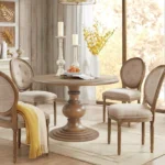 Modern 46 round walnut pedestal dining table by Goldoma, perfect for small dining rooms