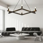 Farmhouse chandelier in black metal with candle-style lights, centered over a wooden dining table in a cozy room.