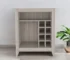 Modern bar cart in light gray with wine bottles and glasses on two tiers