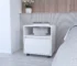 White bedroom side table with drawer and open shelf on wheels in a modern bedroom