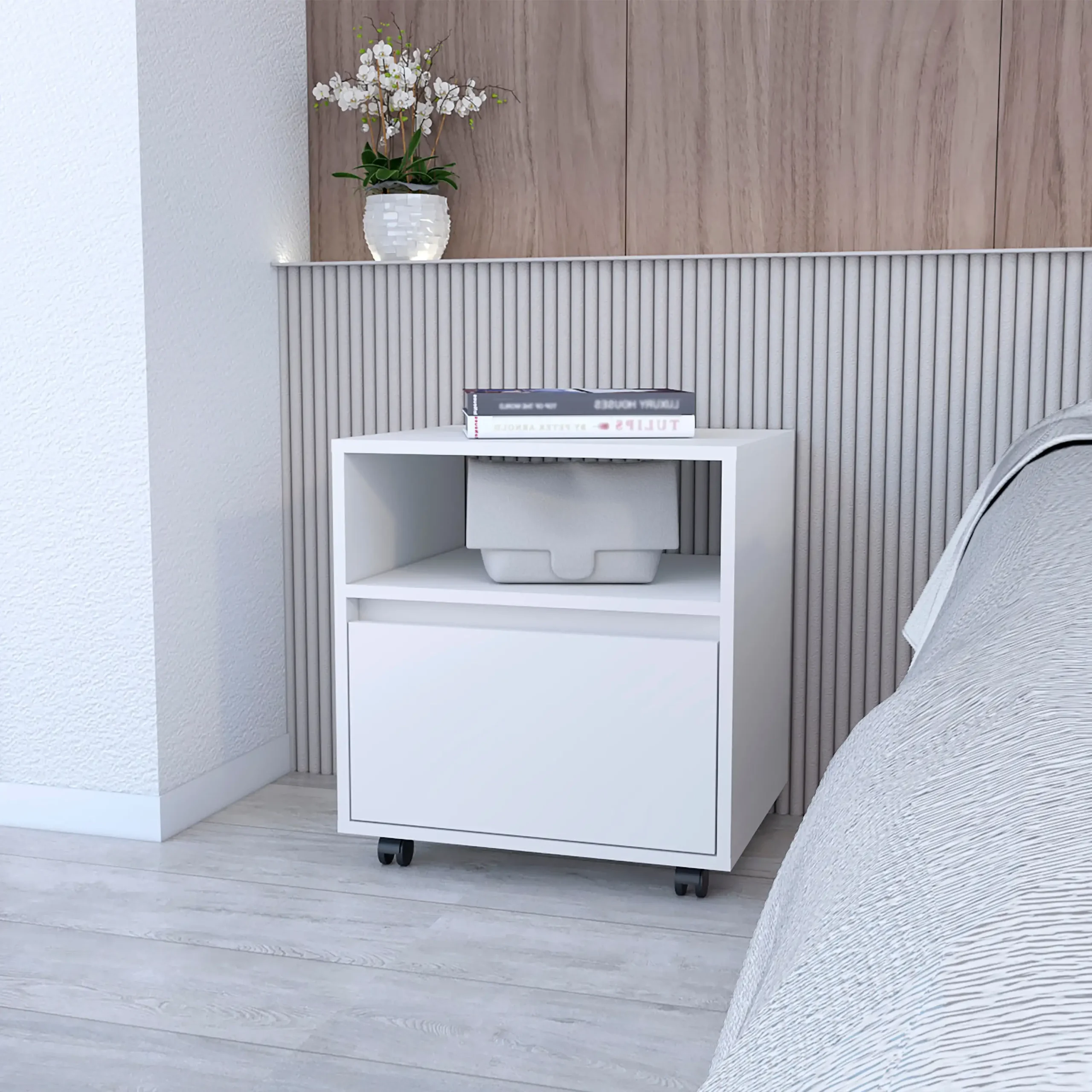 White bedroom side table with drawer and open shelf on wheels in a modern bedroom