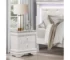 White nightstand with drawers featuring faux alligator embossed drawer fronts