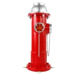 Resin hydrant statue illuminated at dusk, with solar light emitting a warm glow through the top panel.