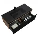 Quartz sands basin on the black vanity, reflecting light and showing the smooth, durable surface ideal for hotel