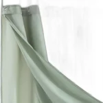 Modern grid sage green shower curtain with waterproof PEVA material in a bright bathroom