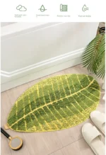 Soft absorbent bath mat in bathroom with banana leaf texture