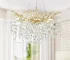 Modern crystal chandelier with tree branch design in a dining room