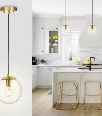 Brass ceiling pendant light with glass ball shade hanging over a wooden kitchen island, warm glow.
