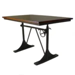 Goldoma 48 inch solid wood and iron trestle dining table with brown top and black base in a dining room setting