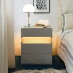 Modern LED nightstand with 3 drawers featuring illuminated acrylic panel in grey with gold veining