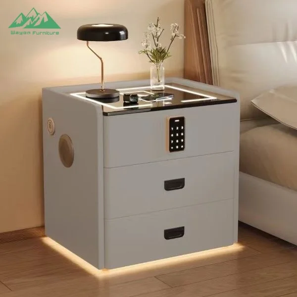 H33acf597dff54d5d9a2cf965afeb9839S.webp Modern smart nightstand with digital lock, Bluetooth speaker, and wireless charging pad - 3-drawer bedside table in bedroom setting