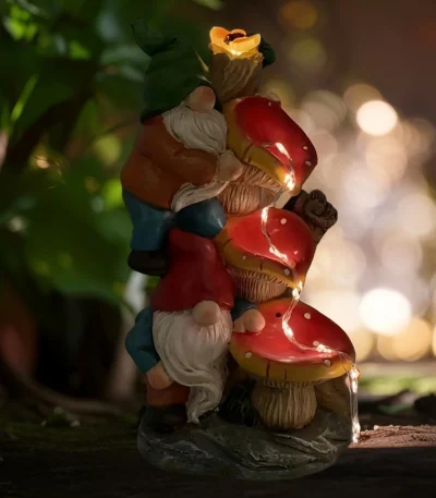 Solar gnome statue glowing in garden at dusk