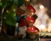 Solar gnome statue glowing in garden at dusk