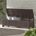 Goldoma PE wicker storage bench with hidden compartment in weathered brown finish on patio