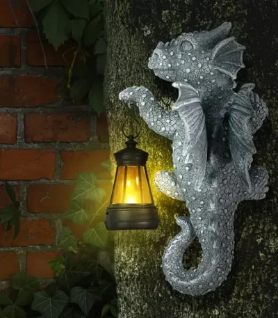 Solar dragon lantern glowing on a tree trunk at night, dragon figurine resin garden decor