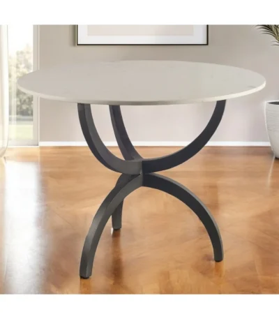 Goldoma 40 inch round marble dining table with black metal three-leg base in a modern dining room setting