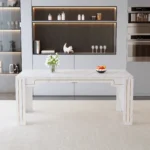 Modern white MDF dining table with grooved legs in a bright dining room setting