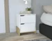 Glossy nightstand with drawers in a modern bedroom setup