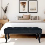 Mid-century velvet ottoman with wood legs in black - Goldoma
