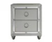 Chloe Gemstone silver mirrored nightstand with ring pulls beside a bed