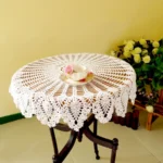 Vintage lace table mats in shabby chic style on a wooden table