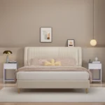 Modern nightstand with scalloped edge drawer and open shelf in lilac color, placed beside a bed