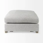 Goldoma light gray fabric cocktail ottoman with brown wood frame in living room