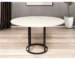 48" round marble dining table with white marble top and black metal pedestal base in a modern dining room