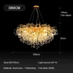 Modern crystal chandelier in black chrome and gold with raindrop crystals hanging in a living room