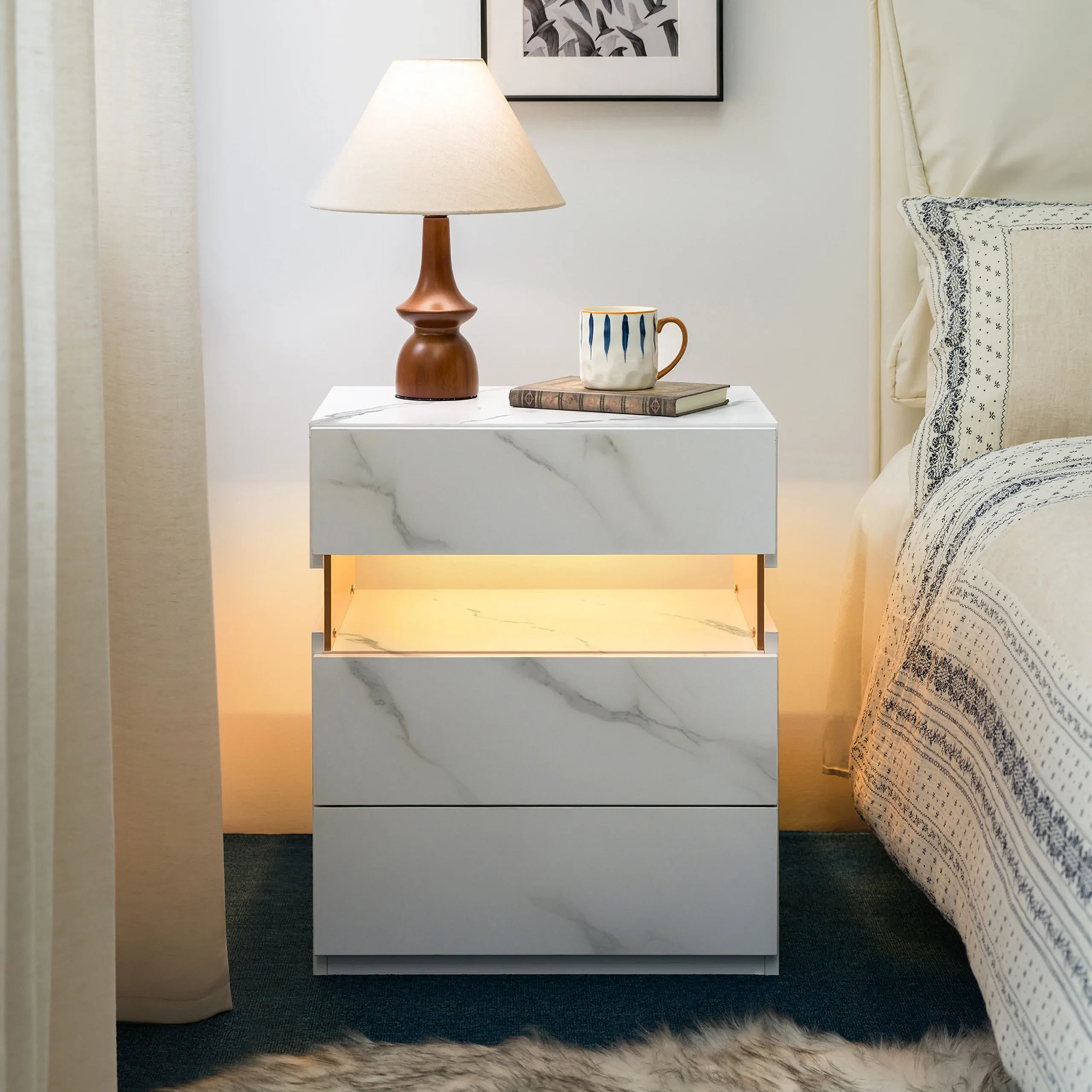 H3ed027765281437da8ea5462c718d932i.webp LED nightstand 3 drawer with white stone acrylic finish, featuring three storage drawers and ambient LED lighting.