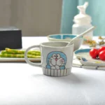 Japanese ceramic dinnerware set with hand-drawn cat design on blue rectangular plate and bowl