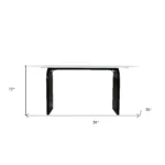 72-inch white and black marble oval dining table with solid wood sled base in a dining room setting