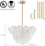 Vintage gold chandelier hanging over a dining table with warm glow