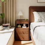 Narrow solid walnut nightstand with 3 drawers in a modern bedroom setting