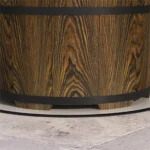 Brown fire pit with glowing flames in a backyard setting
