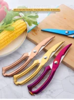 Goldoma heavy duty kitchen shears cutting through chicken bone on cutting board