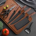 Goldoma chef knife set with wooden handles on cutting board