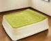 Goldoma queen air mattress with head raise in moss green, showing raised head position and flocked top