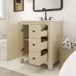Open cabinet doors display interior shelf, with plumbing visible under the sink, in a modern bathroom setting.